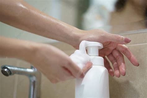 Female Hands Dispensing Liquid Soap To Wash Hands Ideal For Hygiene