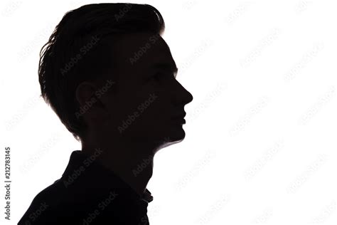 Silhouette Of An Unrecognizable Guy Man Face Profile On A White