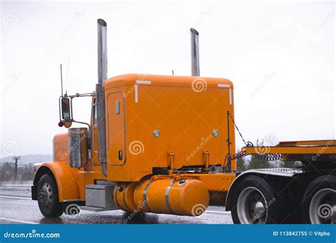 Classic Bright Orange Big Rig Semi Truck Tractor Transporting Fl Stock