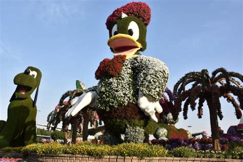 Disney Characters at Dubai Miracle Garden in the UAE Editorial Photo - Image of disney, burj ...