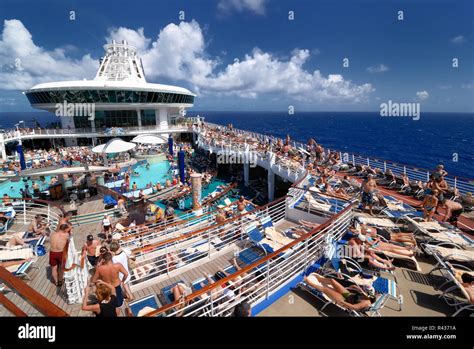 The pool deck on Royal Caribbean's Adventure of the Seas cruise ship is ...