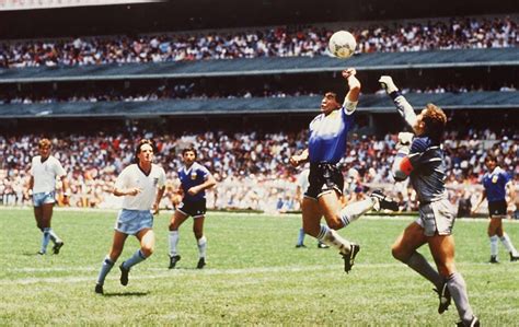 Diego Maradona scores the infamous Hand of God goal, 1986