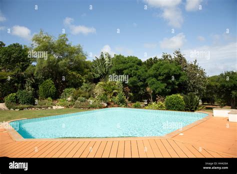 Private Tropical Swimming Pool With Recycled Plastic Decking With