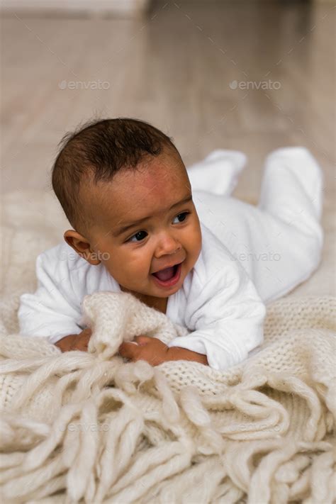 Portrait of a mixed race baby boy Stock Photo by Satura_ | PhotoDune