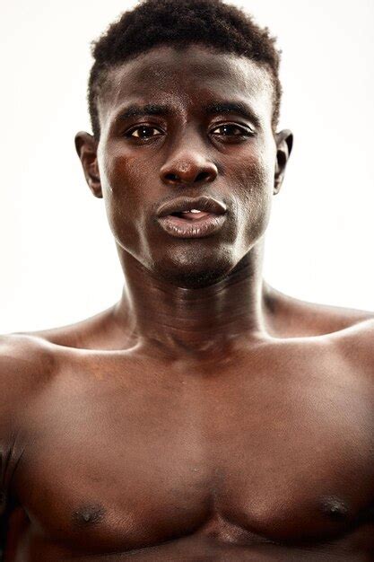 Premium Photo Portrait Of Shirtless Man Standing Against White Background