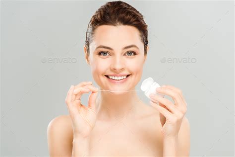Cheerful Naked Woman Holding Dental Floss And Smiling Isolated On Grey