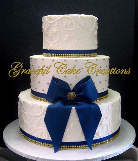 Elegant Ivory Butter Cream Wedding Cake With Gold Sugar Pearls And Navy