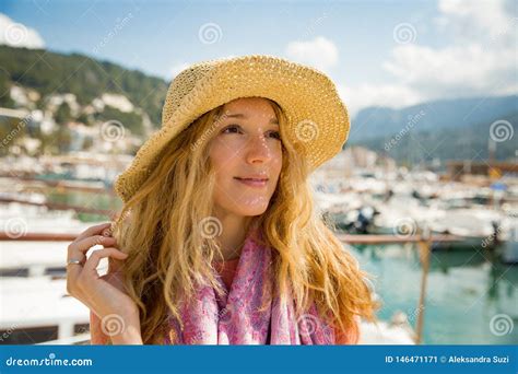 Portrait Of Young Woman With Light Curly Hair In Straw Hat Stock Image