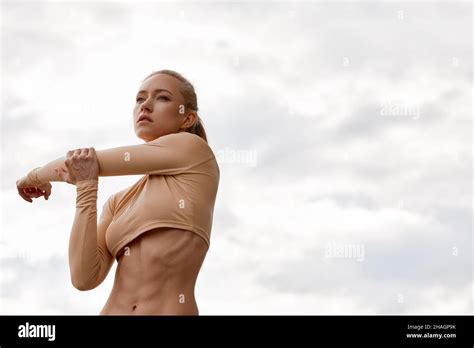 The Blonde Poses For The Camera In Between Workouts Attractive Athletic Woman Exercising