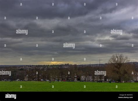 Sun Rays Shining Through The Clouds Hilly Fields Brockley Stock Photo