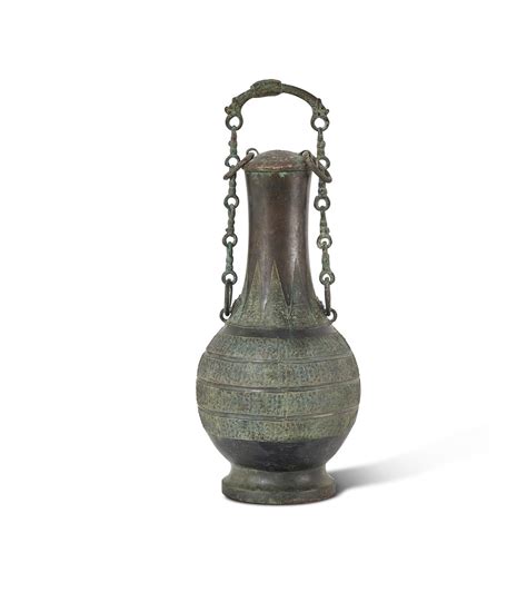 An Archaic Bronze Ritual Wine Vessel And Cover Hu Warring States