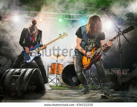 Rock Band Performs On Stage Guitarist Stock Photo Shutterstock