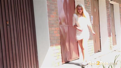 Nervous Looking Blonde Sprays Her Piss Outside