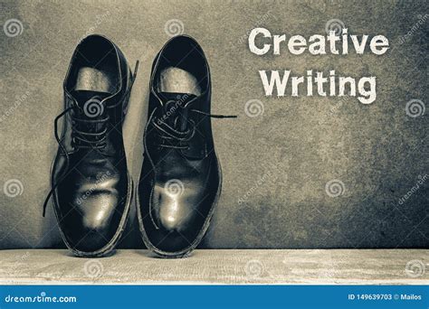 Creative Writing On Brown Board And Work Shoes On Wooden Floor Stock