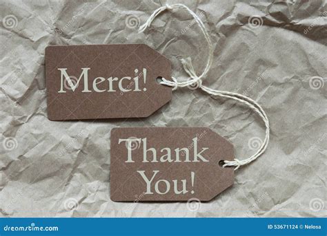 Two Beige Labels Merci Means Thank You Stock Photo Image Of Language