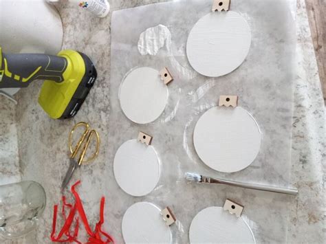 How to Decoupauge Wood Ornaments With Festive Napkins | Hometalk