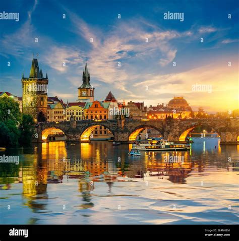 Fiery sunset over Charles bridge on river Vltava in Prague Stock Photo ...