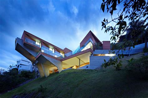 Sculptural Concrete House Built On A Steep Slope