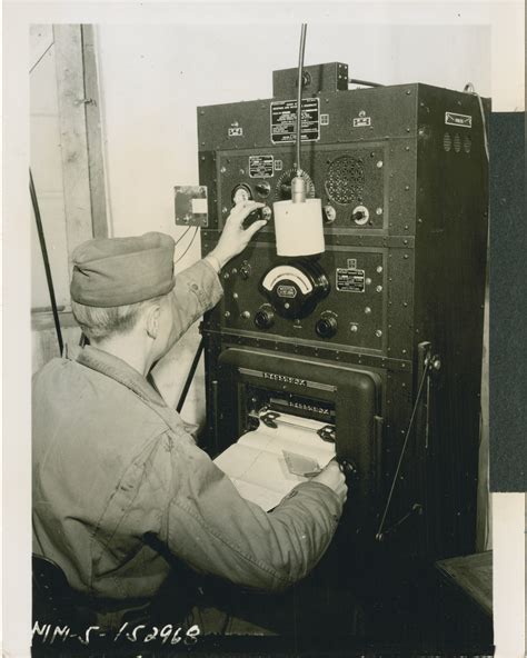 US soldier prepares radio transmitter, Pomigliano, Italy, 1944 | The
