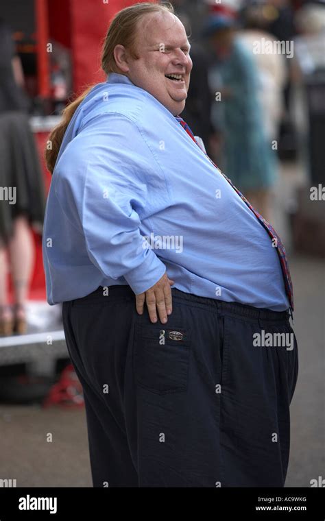 Fat Man with a Pony Tail at the Races Stock Photo - Alamy