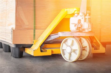 Hand Pallet Truck And Pallet Of Package Boxes Pallet Jack Forklift