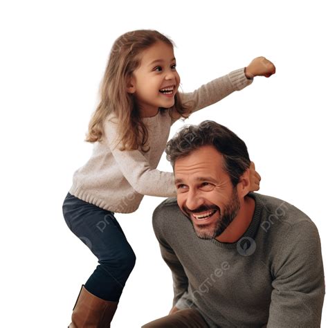 A Little Daughter Plays With Her Dad Sitting On His Shoulders While Decorating A Christmas Tree