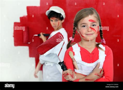 Children Painting A Wall Red Stock Photo Alamy