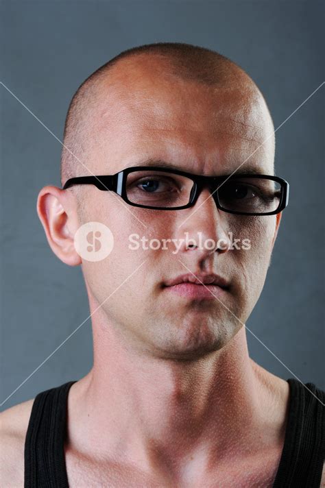 Bald Man With Glasses In His Twenties Royalty Free Stock Image Storyblocks