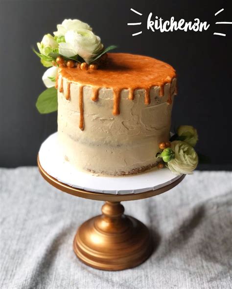 Semi Naked Gold Drip Cake With Fresh Ranunculus And Roses