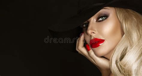 Beautiful Woman In Elegant Makeup With Red Lips And Nails Posing