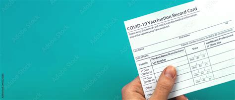 Doctor is holding COVID-19 vaccination record card, banner, concept of ...