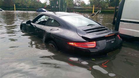 Porsche 911 Caught By The Flood Drowns In Muddy Water Autoevolution