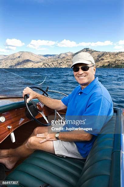 69 Man Driving Speed Boat Wearing White Outfit Stock Photos High Res