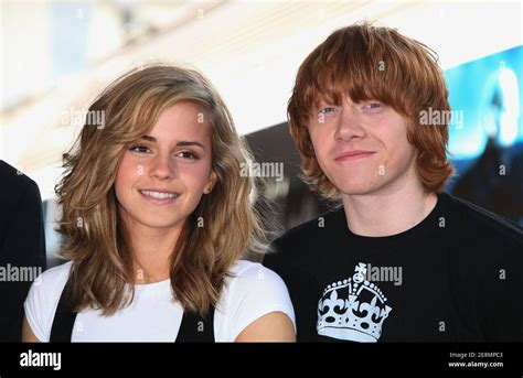 British Actors Rupert Grint And Emma Watson Pose During A Photocall For