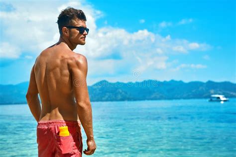 Man Summer Fashion Male Model Tanning By Pool Skin Tan Stock Photo