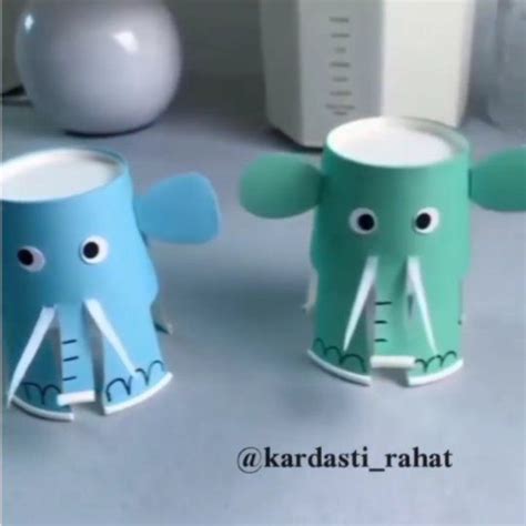 Two Paper Cups That Have Elephants On Them