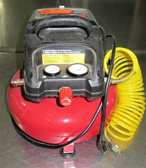 Central Pneumatic Model 95275 Air Compressor w/ Air Hose - Oahu Auctions