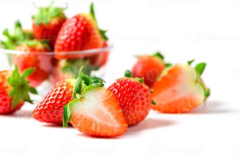 Sliced Strawberries with leaf isolate. Whole and half of strawberry on