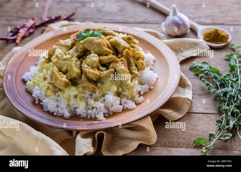 Indian chicken curry with white rice Stock Photo - Alamy