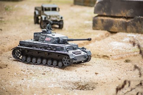 Vehicle Model Tank And Car Model On Sand Table Background, Car ...