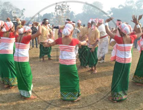 Image Of Assamese Tribal Woman Performing Bihu Dance In Magh Bihu