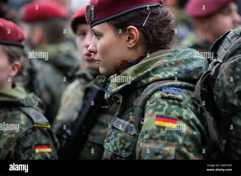 Bucharest, Romania - December 01, 2019: German female soldier is taking ...