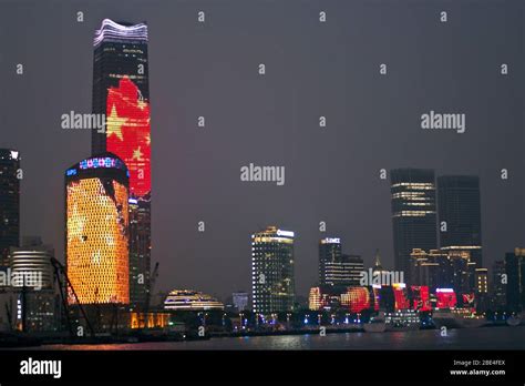 Shanghai skyscrapers at night picturing the Chinese flag, illuminated ...