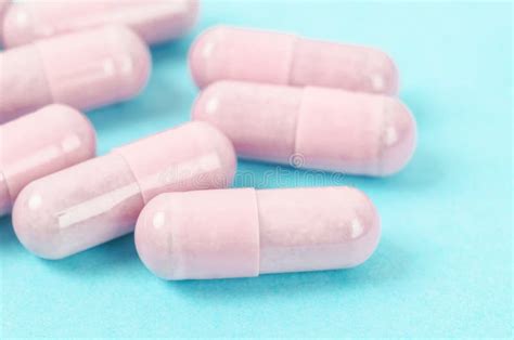 Pink Capsule Pills on Blue Background Stock Image - Image of abstract, drug: 247049003