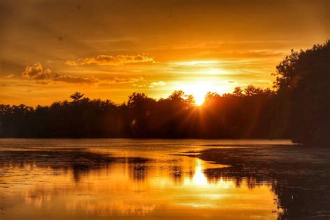 Yellow Sky and Sunlight over Lake at Sunset · Free Stock Photo