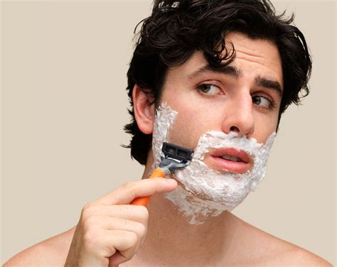 An Image Of A Man Shaving With Precision Using Harrys Blades