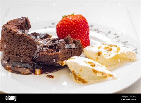 Chocolate Cake Volcano With Creamy Ice Cream And Strawberries Stock