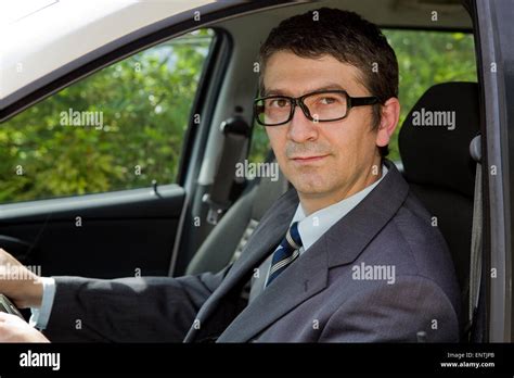 Happy Businessman Sitting In Drivers Seat In His Car Stock Photo Alamy