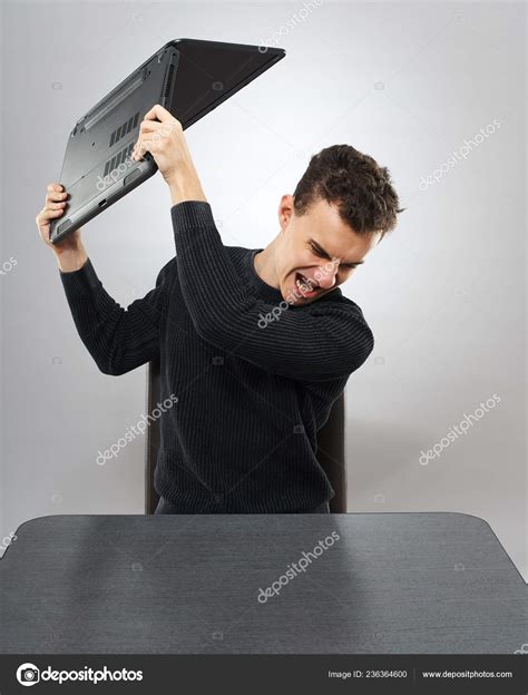 Angry Student Smashing His Laptop Table Stock Photo by ©Xalanx 236364600