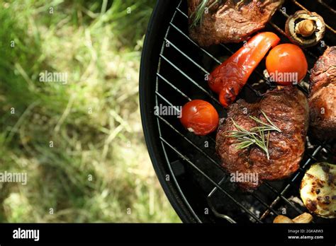 Tasty Steaks And Vegetables On Barbecue Grill Outdoors Stock Photo Alamy